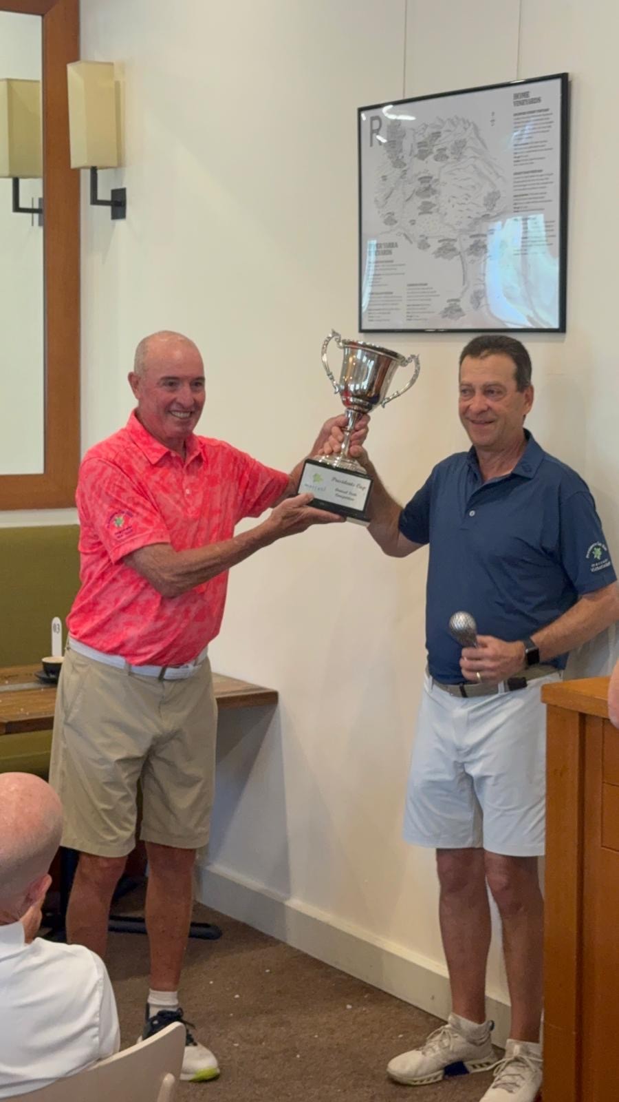 Allen Garb presenting the trophy to Joe Dorfman captain of Victoria team